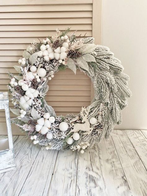 Beautiful winter wreath for front door white. The wreath is decorated with artificial twigs, pinecones, artificial apples, sheaves from branches white berries and natural cotton. The diameter of the wreath is 20 in. A wreath can adorn your door all winter. Care: Recommended for indoor or covered outdoor use. See other Christmas wreath you can see by clicking on the link: https://www.etsy.com/shop/HomeBeautyDecor?ref=seller-platform-mcnav&section_id=24038466 See other wreaths you can see by clicking on the link: https://www.etsy.com/shop/HomeBeautyDecor?ref=seller-platform-mcnavPayment-I accept only Paypal Please note! Parcel will go to you depending on your location. - USA: 2 - 4 weeks - Canada: 2-5 weeks - Australia: 3-6 weeks - Europe: 2-3 weeks - Japan 2-3 weeks January Door Wreaths, White Winter Wreaths For Front Door, Winter Wreath Ideas After Christmas, White Wreaths For Front Door, January Wreath Ideas, White Twig Wreath, January Wreath, Winter Wreaths For Front Door, Front Door White