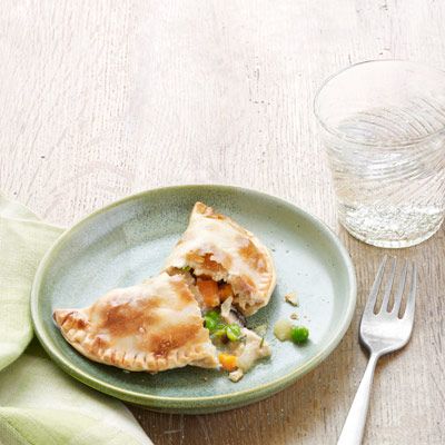 Chicken Potpie Turnovers  Premade empanada dough saves time, as well as 9 grams of fat and 88 calories, versus piecrust. That, plus opting for all-white chicken meat and low-fat milk (no cream or butter), brings the total to 196 calories, 22 grams of fat, and 83 milligrams of cholesterol per serving. Empanada Dough, Chicken Potpie, Turnover Recipes, Pot Pies Recipes, Chicken Meat, Chicken Pot Pie Recipes, 300 Calories, White Chicken, Favorite Comfort Food