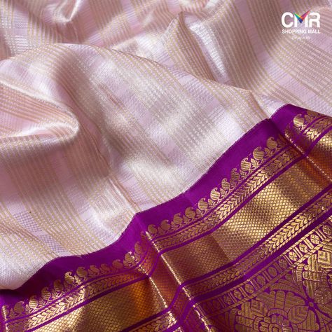 Make a dramatic style statement with this Pastel Pink Kanjeevaram Silk Saree! The artistic fineness of the gold zari lines on the pink silk captivates your regal elegance. The weave is lent a vivacious twist with a purple border and gold zari.
.
.
.
#kanchisilk #kanchipuramsilk #kanjeevaram #kanchisaree #silk #silksaree #sixyardsofelegance #bridalsaree #traditionalsaree #vizag #eluru #anakapalle #tirupathi #rajahmundry #guntur #gajuwaka #vizianagaram #kakinada #gopalapatnam #srikakulam #cmr Vadamalli Colour Silk Saree, Pastel Pink Saree Silk, Kanjeevaram Sarees Silk, Pastel Sarees, Pink Saree Silk, Saree Color Combinations, Elegant Sarees, Kanjeevaram Silk Saree, Purple Border