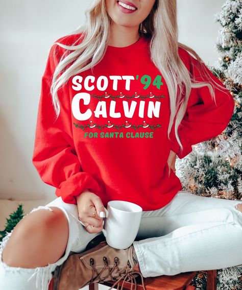 Scott Calvin For Santa Clause Sweatshirt | Santa Claus Shirt | 90s Movie Shirt | Christmas Sweater | Christmas Movie Shirt This is a fun election sweatshirt for Scott Calvin from the 1994 Christmas movie classic, The Santa Clause. It's a unisex Gildan crewneck made out of 50% cotton and 50% polyester. It's the perfect Christmas sweater for anyone who loves the movie or just wants to get into the holiday spirit! SIZE AND FIT: Your sweatshirt design will be printed on a high-quality, soft and comf Mama Tee, Mama Shirts, Mama Sweatshirt, Christmas Mom, Womens Crewneck, Favorite Sweater, Brother Scan And Cut, Christmas Tees, Holly Jolly