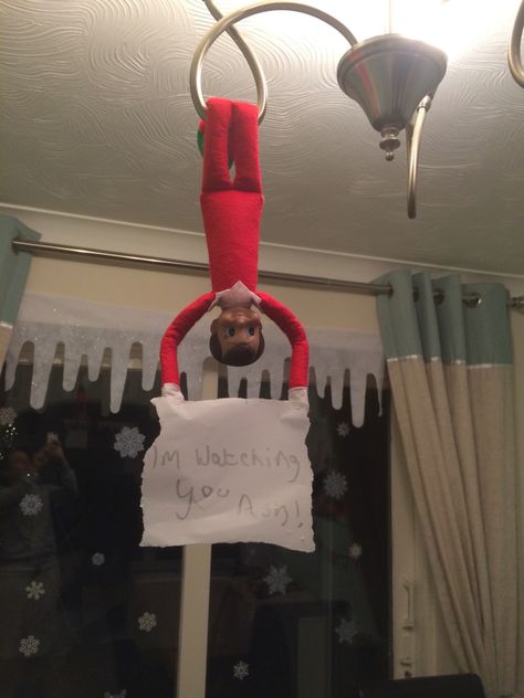 Plummer the elf hanging from the light fitting over the dining table with a sign saying "I'm watching you Ash!" North Pole Breakfast, Elf Ideas, Im Back, Winter Holiday, The Elf, On The Shelf, Sign Quotes, A Sign, Light Fittings