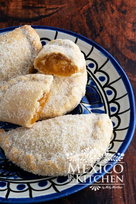 Dessert empanadas, also known as sweet empanadas, are a delectable variation of the traditional savory empanadas. They are easy to make and will satisfy even the most discerning sweet tooth. Pina Empanadas Recipe, Strawberry Empanadas Recipe, Butternut Squash Empanadas, Empanadas Dough Sweet, Authentic Mexican Empanadas Recipe, Peach Empanadas Recipes, Mexican Holiday Desserts, Mexican Dessert Empanadas, Holiday Empanadas