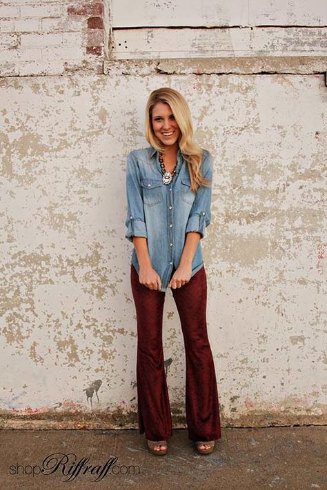 DENIM & VELVET Today's outfit of the day is all about texture! We've paired our new Denim Button-Up Shirt with our Maroon Velvet Bell-Bottoms for an all around stellar look. This outfit has a slight seventies vibe, yet is totally current! Shop Carly's entire look today on www.shopriffraff.com. Flare Pants Outfit Winter, Velvet Flare Pants Outfit, Flare Pants Outfit, 70s Fashion Outfits, Velvet Flare Pants, 70s Women, Rodeo Outfits, Camisa Jeans, Velvet Shirt