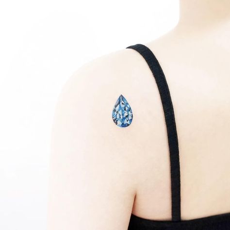 Tear drop jewel tattoo by Tattooist Ida #TattooistIda #Ida #jeweltattoos #color #realism #realistic #hyperrealism #teardrop #blue #jewel #gem #crystal #watercolor #tattoooftheday Jewel Tattoos, Water Drop Tattoo, Teardrop Tattoo, Diamond Tattoo, Gem Tattoo, Filigree Tattoo, Jewel Tattoo, Crystal Tattoo, Bestie Tattoo