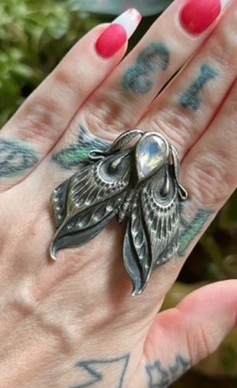 Bloodmilk: moth ring, sterling silver with moonstone (sold on Poshmark for US $307.97, 18 August 2023) Moth Wedding Ring, Moth Wedding, Moth Ring, Moth Jewelry, Bug Ring, Bug Jewelry, Found Object Jewelry, Silver Ring Designs, Vintage Jewelry Crafts