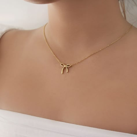 Dainty Ribbon Pendent Necklace  - This listing is for pair os the Dainty Ribbon Pendent Necklace. Perfect for everyday and layering - Length: 16" + 2" extender  - Base Material: High Quality Stainless Steel - Finish: 18K Gold - Nickel Free and Tarnish Free - All our jewelry is packaged in gift ready boxes. If you would like multiple items from your order packaged separately please let us know! © 2024 Generation of Daughters Dainty Gold Pendant, Gold Necklace Women Simple, Gold Pendant Jewelry Simple, Pendant Designs Gold Simple, Pendent Necklace Pendants, Gold Necklace Aesthetic, Minimalist Accessories Jewellery, Pendent Gold, Simple Necklace Designs