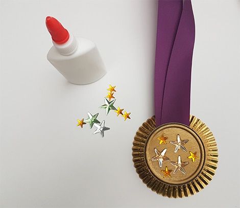 Winter Olympics Craft Idea: Make Your Own Medals | Play | CBC Parents Gold Medal Craft, Olympic Medal Craft, Medal Craft, Medal Stand, Olympic Idea, Olympic Crafts, 2024 Olympics, Vbs 2024, Olympic Medals