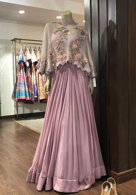 Beautiful Satin-Silk Skirt Lehenga.  Paired with inner blouse and crop top jacket. Embellished with hand embroidery work with zardose and resham work. Stylish with modern silhouettes and traditional embellishments. #dress #silhouettes #indowestern #Gown #Lehenga #Asmairaa #trendy #festival Indowestern Gowns, Indian Wedding Gowns, Indian Gowns Dresses, Indian Gowns, Stylish Party Dresses, Party Wear Indian Dresses, Fancy Dress Design, Dress Silk, Stylish Dresses For Girls