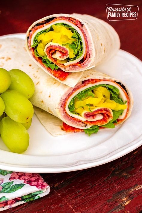 This Zesty Italian Wrap is loaded with ham, salami, and pepperoni. Perfect for packing in a lunch box for school, or in a cooler for picnics or camping. #lunchrecipe #lunchboxrecipe #lunch #wraprecipe #lunchwrap #Italianwrap #Italiansandwich #FavoriteFamilyRecipes #favfamilyrecipes #FavoriteRecipes #FamilyRecipes #recipes #recipe #food #cooking #HomeMade #RecipeIdeas Wrap Dinner, White Castles, Italian Wrap, Magic Soup, Easy Omelette, Spiced Pears, Lunch Wrap, Coconut Fudge, Guava Cake