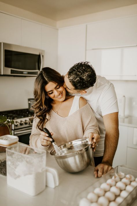 cozy-looking couple mixing ingredients in a bowl in their kitchen Cute Couple In Kitchen, Couple Photoshoot In Kitchen, Cooking Couples Photoshoot, Kitchen Couple Pictures, Christmas Kitchen Photoshoot Couple, Baking Couples Photoshoot, Engagement Photos Cooking, Couple Photoshoot Kitchen, Christmas Baking Photoshoot Couple