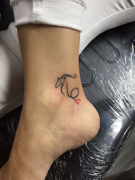 Capricorn #smalltattoo #ankletattoo Capricorn Finger Tattoos For Women, Mini Capricorn Tattoo, Capricorn Aquarius Cusp Tattoo, Capricorn Simple Tattoo, Capricorn Tattoo Minimalist, Capricorn Neck Tattoo, Red Capricorn Tattoo, Capricorn Inspired Tattoos, Capricorn Sign Tattoo For Women