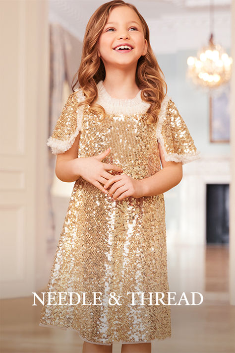 The Matilda Dress in Gold. This beautiful dress is decorated with shimmering sequins, creating an ultimate sparkle. Designed with square cut sleeves trimmed with tulle ruffles to add a Needle & Thread signature look. Update your little one's wardrobe with the ultimate fairy-tale dress of the season. Sequin Flower Girl Dress, Tale Dress, Tulle Ruffles, Children's Dresses, Sequin Flower, Girls Lace Dress, Dresses For Girls, Fairytale Dress, Family Pics