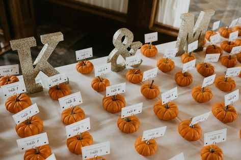 Mini pumpkin place cards! Pumpkin Place Cards Wedding, Pumpkin Seating Cards, Fall Card Table Wedding, Wedding Table With Pumpkins, Pumpkin Table Numbers Wedding, Pumpkin Name Place Cards, Thanksgiving Themed Wedding, Fall Name Cards Wedding, Pumpkin Seating Chart Wedding