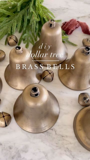 Amelia | Home Decor & DIY on Instagram: "🌲 Want to make your own “brass” bells? This easy tutorial made the perfect brass Christmas bells for our barn door wreaths. I really wanted more bells but didn’t want to spend much money so these plastic bells from @dollartree were perfect once painted. At $1.25 per plastic bell and $1.25 for a pack of 6 metal bells, I knew these would work great! Tutorial: •Plastic bells from dollar tree in varied sizes & packs of gold metal bells. •Spray all the bells with flat black spray paint •Once dry paint all the bells with antique gold rub’n buff •String bells with ribbon, twine or burlap twine Enjoy!! . . . ᴡᴇʟᴄᴏᴍᴇ ᴛᴏ ᴛʜᴇ ᴀᴛ ʜᴏᴍᴇ ᴄᴏʟʟᴇᴄᴛɪᴠᴇ! Here’s How To Join! 1. Follow All Main Hosts and the Community Page: @athomecollectivecommunity @theholl Christmas Brass Bells, Diy Bell Christmas Ornament, Diy Christmas Cow Bells, Rustic Bells Decor Christmas Decorations, Diy Gold Bells, Diy Vintage Bells, How To Make Christmas Bells, Diy Bells Christmas, Diy Christmas Bells Decorations