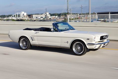 Revology 1966 Mustang Convertible in Wimbledon White with Oxford White top and Porsche Black Nappa leather interior. This car features LED headlamps, no fog lamps, Mustang fuel cap, rear valance with bumperettes, quarter trim ornaments, and stainless rocker moldings. The Premium package joins the GT package in our 1965-66 Mustang lineup. Like the GT, it is equipped with the 460hp Ford 5.0 Gen 3 Ti-VCT V8 engine, so it delivers the same performance, with a slightly different look. 1965 Shelby Mustang, Mustang 1966 Convertible, 1967 Ford Mustang Convertible, White Vintage Convertible, Vintage Mustang Convertible, White Convertible Mustang, Ford Mustang Convertible 1967, Vintage White Mustang, White Mustang Aesthetic