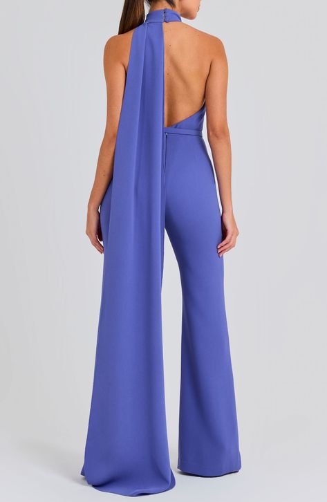 An open back and a halter neck bring flirty appeal to this wide-leg jumpsuit with a drapey detail that flows down the back of this belted jumpsuit. 63 1/2" center front length; 34 1/2" inseam; 26" leg opening (size 8) Hidden back zip; keyhole with button-and-loop closure Halter neck Sleeveless, with cutaway shoulders Removable belt Stretch lining 100% polyester Dry clean or hand wash, dry flat Imported Classy Jumpsuit Outfits, Jumpsuit Formal, Fancy Jumpsuit, Nadine Merabi, Black Lace Jumpsuit, Jumpsuit For Wedding Guest, Classy Jumpsuit, Halter Neck Jumpsuit, Formal Jumpsuit