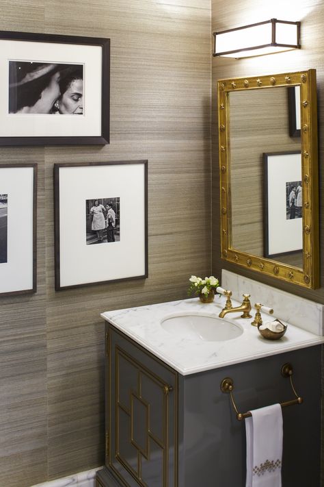 The powder room details--metallic-thread grass cloth, a custom vanity with molding faux gilded to look like metal--relate to the study. Wallpaper Masculine, Fresh Wallpaper, Wallpaper Powder Room, Glam Bathroom, Powder Room Wallpaper, Home Luxury, Grasscloth Wallpaper, Bath Room, Bathroom Wallpaper