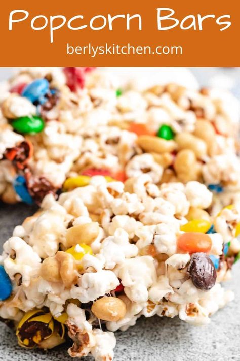 Popcorn bars are a gooey, sweet snack that's loaded with melted marshmallows, chocolate candies, and savory peanuts. #berlyskitchen Popcorn Bar Recipes, Popcorn Snacks, Chocolate Candies, Popcorn Bar, Recipes With Marshmallows, Marshmallow Creme, Popcorn Recipes, Rice Crispy Treats, Trending Recipes