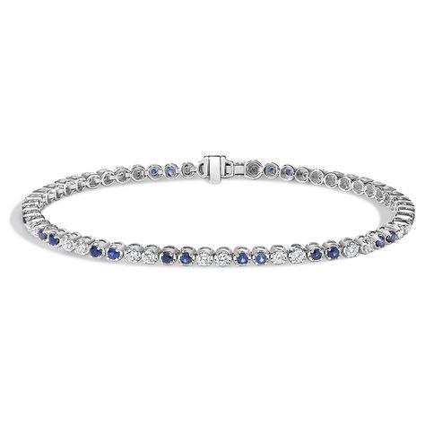 Sapphire and Diamond Tennis Bracelet - 18K White Gold. This classic tennis bracelet features alternating duos of blue sapphires and shining diamonds that wrap the wrist in an aura of light (7/8 total carat weight). Sapphire Diamond Tennis Bracelet, Tacori Engagement Rings, Solid Gold Bracelet, Trending Engagement Rings, Cz Bracelet, Ring Trends, White Gold Sapphire, Chic Bracelet, Diamond Tennis Bracelet