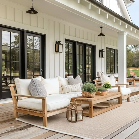 Charming modern farmhouse garden with decor and furnishings that match the home’s color palette Modern Farmhouse Exterior Bungalow, Outdoor Patio Ideas Modern, Patio Ideas Modern, Modern Farmhouse Ranch Exterior, Modern Screened In Porch, Modern Farmhouse Color Palette, Modern Farmhouse Backyard, Farmhouse Screened In Porch, Bison Ranch