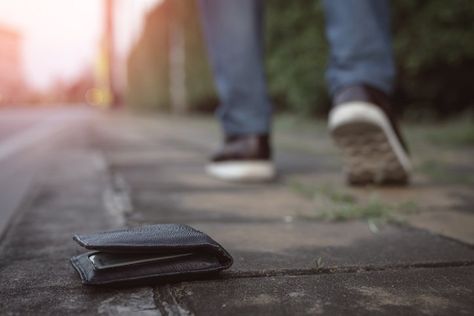 A wallet dropped on the sidewalk as the owner walks away. Atm Card, Lost Money, Style Guide, Debit Card, Credit Card, Lost, Wallet