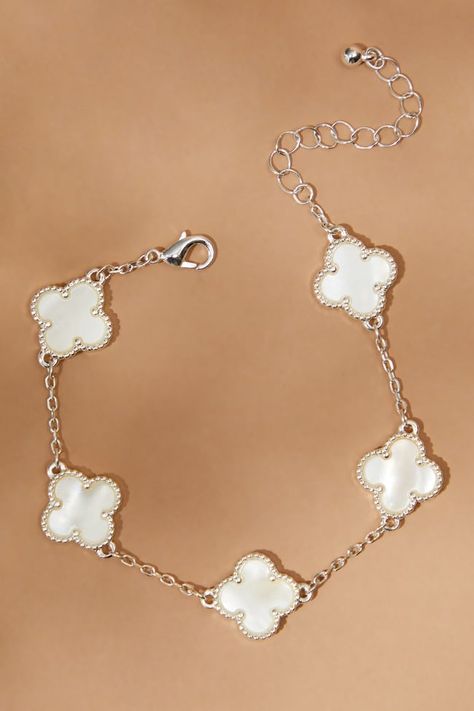 This dainty bracelet features clover motifs all around, creating a charming and elegant design that is perfect for everyday wear. Its stunning silver color adds a touch of sophistication, making it a versatile and eye-catching accessory for any occasion. Altered State Jewelry, Altar’d State Jewelry, Altar'd State Jewelry, Altars State, Jewelry Styling, Pretty Jewelry Necklaces, Preppy Jewelry, Clover Bracelet, Silver Bracelets For Women