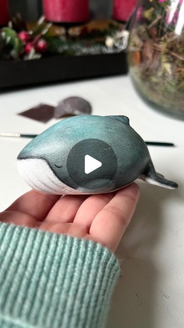 Johanna Excell | Wildlife artist on Instagram: "Lumpy the sleepy whale 🐳🤍 I’ve wanted to dabble in ceramics for a while now, but I can’t justify buying a kiln just yet. So instead I bought some air dry clay and sculpted a 3D version of one of my watercolor whales. . I wanted it to have a very specific look - sort of a patina. I knew I wouldn’t be able to achieve it with acrylics, so I experimented with soft pastels, and even though the process was quite frustrating, I think it was worth the time and the trouble 🤗 I’m excited about this new direction and can’t wait to create more sleepies 🤍 . . . . . #whale #whaleart #airdryclay #humpbackwhale #oceanart #whalesculpture" Clay Whales Ceramics, Air Dry Clay Whale, Watercolor Whales, Watercolor Whale, Whale Art, Wildlife Artists, Humpback Whale, Dry Clay, Ocean Art