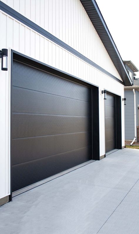 Flush Panel Residential Garage Door | Midland Garage Door Simple Modern Garage Door, White House Black Garage Door Modern Farmhouse, Garage Door Panels Ideas, Modern Farmhouse Garage Door Ideas, Large Shop Doors, Chi Black Garage Doors, Skyline Flush Garage Door, Black Garage Door Exterior House Colors, Shop House Front Doors