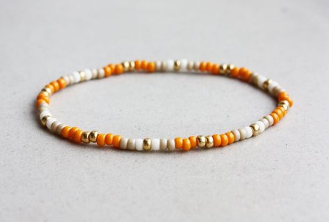 Orange, Beige, Cream & Gold Bracelet - 3mm beads - stretchy I can make the bracelet to your size.  Just send me a message or you will receive a standard size bracelet. Tiny Bead Bracelet, Funky Bracelet, Stretchy Beaded Bracelet, Orange Bracelet, Beaded Jewelry Necklaces, Hippie Bracelets, Diy Bracelets Patterns, Beads Bracelet Design, Small Beads