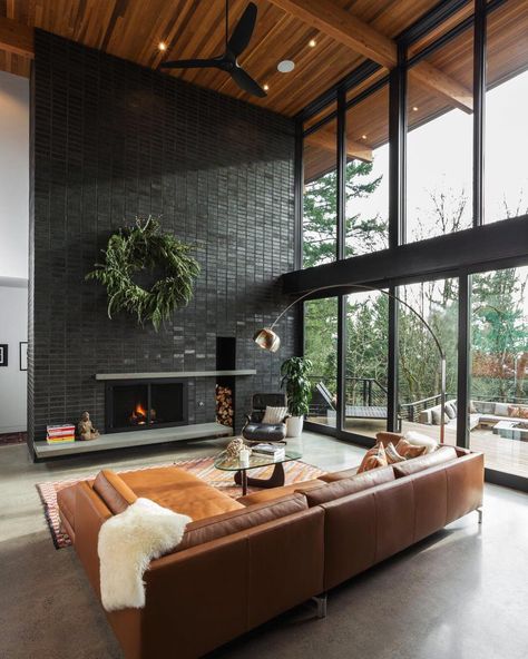 15 Black Brick Fireplace Ideas That Are Simply Stunning Black Brick Tile Fireplace, Over Grouted Brick Fireplace, Black Brick Wall Living Room, Black Brick Fireplace Wall, Brick Tv Wall Ideas, Black Tiled Fireplace, Painted Brick Interior Wall, Limewash Brick Fireplace, Painted Brick Interior