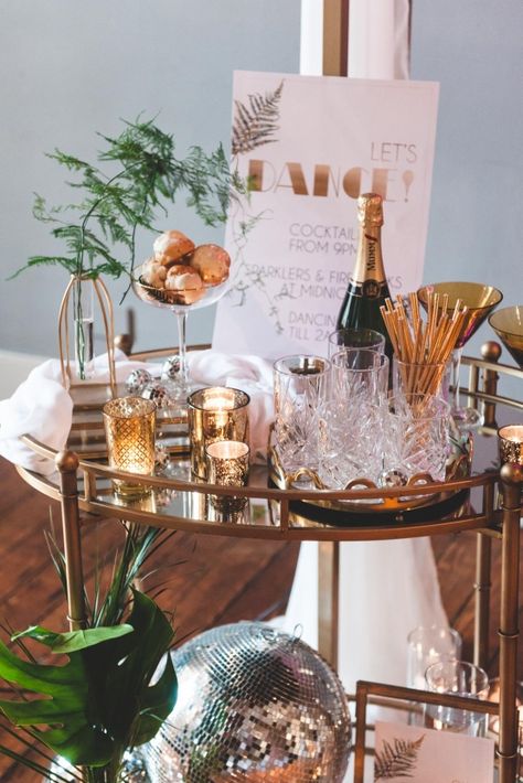 Serve the cocktail and champagne on a gold cart with even more gold accents and a disco ball for the perfect retro Studio 54 vibes. (PS. If you like what you see, follow us for more wedding inspiration!) Photo: Boho Chic Weddings via Bridal Musings #weddingreceptionideas #beveragestation Gold Disco Ball Aesthetic, Boho Disco Cake, Disco Ball Bar Cart, Gold Disco Ball Wedding, Hens Aesthetic, Boho Disco Party, Gold Disco Party, Studio 54 Wedding, Tropical Disco Wedding