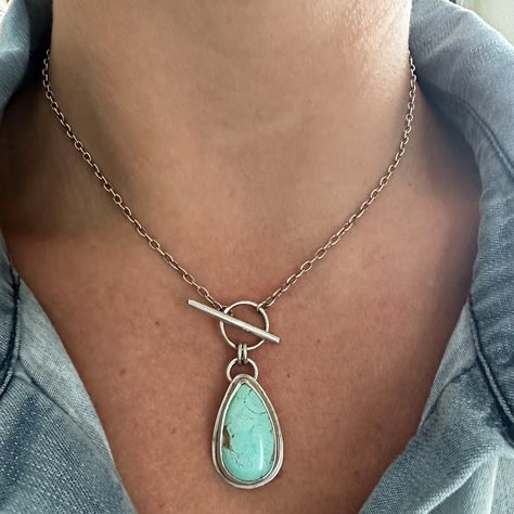 An every day staple necklace with the ease of a front toggle closure. Beautiful teardrop Royston Turquoise set in .925 fine silver and finished on 16" sterling silver chain. Pendant measures 30 x 16.5mm All of my work is hand crafted, from sourcing the stones from sustainable miners and lapidary artist, to forging the piece from sterling and fine silver sheet metal and wire. Over time, sterling silver develops a lovely patina, the more you wear this piece, the more it maintains its original shine. But if it starts to darken, a gentle polish with a soft jewelry cloth will bring it back to life. If you have any questions about this ring or any other pieces, feel free to reach out. Although I'm unable to accept returns or exchanges at this time, I'm here to assist you in finding the perfect t Toggle Necklace Silver, Labradorite Pendant Necklace, Get Back Necklaces Aesthetic, Silver Soldering Jewelry, Copper And Silver Jewelry, Oxidized Sterling Silver Necklace, Metal Smithing Jewelry, Beaded Necklace Ideas, Silversmithing Tutorials