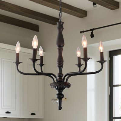 The modern farmhouse design of this glam, classic 6-light metal chandelier features a framework of curved arms with classic candlesticks. The matt black frame conveys a classic vintage style with elegance. Its lights are displayed bare-bulb style, with no shades. This French country chandelier enhances a master living room, formal dining room, or front foyer. What's Included? Canopy Charlton Home® | Charlton Home® 6 - Light Black Candle Chandelier 22.5 H x 24.5 W x 24.5 D in blackMetal in Matte Foyer Farmhouse Entry Ways, Dining Room Lights Farmhouse, French Country Chandelier Kitchen, Antique Chandelier In Kitchen, Modern French Country Lighting, Modern Victorian Chandelier, English Cottage Chandelier, French Farmhouse Dining Room Decor, Dark Academia Chandelier