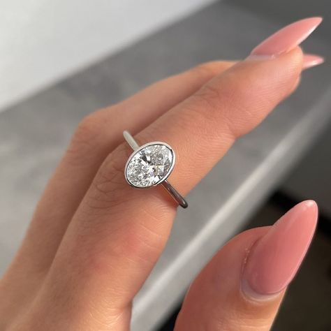 Elongated 2.23 CT Colorless Oval Moissanite Bezel Set Ring | Solitaire Engagement Ring | 14k Yellow Gold Wedding Ring | Delicate Bridal Ring ❤ ITEM DETAILS:- ✦ Brand: TheAmericanJewelShop ✦ Handmade, high-quality item! ✦ Material: Solid 10K/14K/18K Gold, 950 Platinum and 925 Sterling Silver ✦ Diamonds Type: Colorless Moissanite Diamond ✦ Diamond Cut: Elongated Oval Cut ✦ Center Diamond Weight: 2.23 CT ✦ Center Diamond Size: 7x10 MM ✦ Diamond Clarity: VVS/VS ✦ Width of Band: 1.6 Mm (Bottom) ❤ ACCENT Stone:- ✦ Side Stone Material: Colorless Moissanite Diamond ✦ Side Stone Shape: Round Cut ✦ Side Stone Carat Weight: 0.15 CT ✦ Side Stone Color: Colorless ✦ Diamond Clarity: VVS/VS ----------------------------------------------------------------- 💎 Moissanite VS Diamond 💎 --------------------- Lab Created Diamond Rings Engagement, Moissanite Vs Diamond, Bezel Engagement Ring, Bezel Set Ring, Wedding Rings Solitaire, Oval Moissanite, Set Ring, Platinum Metal, Jewelry Diamond