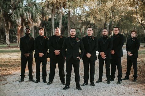 Black on Black Tuxedos for Groomsmen. Not smiling and absolutely delicious 🤤 Safe And Black Wedding, Black Out Tux Wedding, All Black Wedding Tuxedo Grooms, Mens Wedding Tuxedo Ideas Black, Mens All Black Tuxedo Wedding, Black Wedding Men Suit, Mens Black Wedding Attire, Weddings Guests All Black, All Black Wedding Suits Men