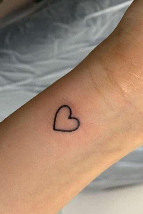 25 Amazing Heart Tattoos For Women To Try In 2023 | Simple heart tattoos, Heart tattoo wrist, Tiny heart tattoos Amazing Tattoos For Women, Heart Tattoos For Women, Simple Heart Tattoo, A Heart Tattoo, Tattoos Heart, Simple Heart Tattoos, Heart Tattoo Wrist, Tattoo Wrist, New Tattoo Designs