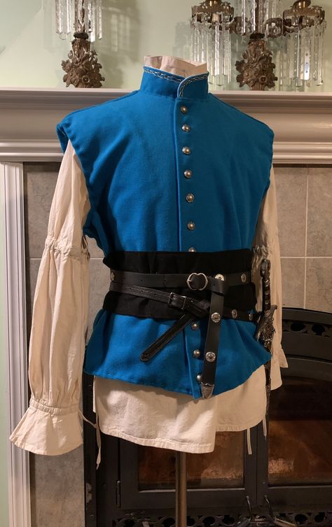 Blue Tunic Medieval, Blue Medieval Outfit Men, Fairytale Clothes Male, Mens Rennaisance Faire Outfit, Light Blue Fantasy Outfit Male, Jerkin For Men, Medevial Outfit, Blue Ren Faire Outfit, Fancy Medieval Clothes Male