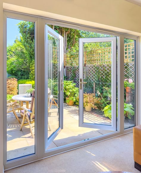 French patio doors with side windows can transform your living space with more natural light.. Patio With French Doors, Large French Doors Patio, Backyard French Doors, French Sliding Doors Exterior, Doors With Side Windows, French Doors With Side Windows, Patio Doors French, Outdoor French Doors, Sliding French Doors Patio