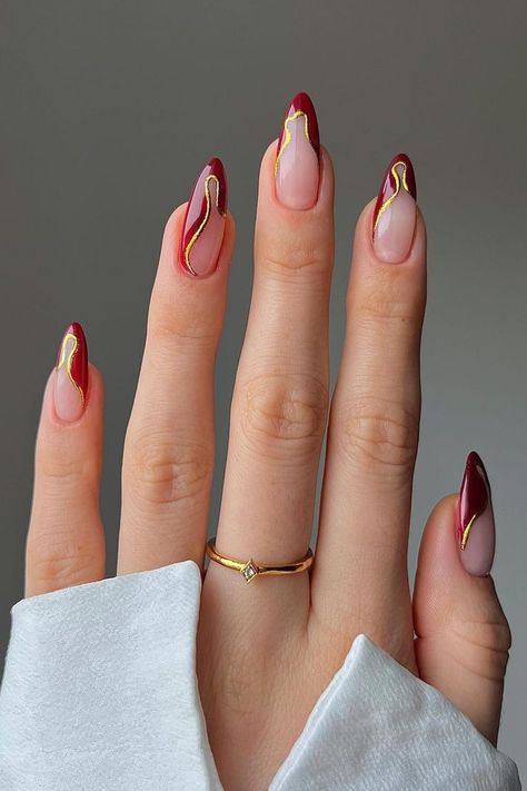 Almond Nails Red And Gold, Red Homecoming Nails Almond, Elegant Red And Gold Nails, Metallic Almond Nails Designs, Nails Prom Red Dress, Red Gold Almond Nails, Red Nails Unique, Red Modern Nails, Sculpted Gel Nail Designs