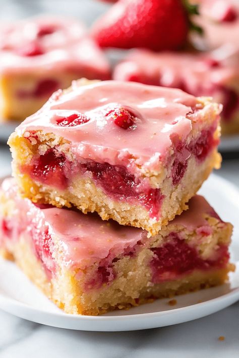 Strawberry Lemon Blondies are a delicious treat that beautifully balances the sweetness of strawberries with the zesty brightness of lemons. These soft, chewy bars are ideal for any occasion! Unlike cookies, bars and brownies are quicker to make and are the perfect dessert to bring to gatherings. This Strawberry Lemon Blondie recipe is bursting with Strawberry Cheesecake Blondies, Strawberry Lemon Blondes, Strawberry Lemon Blondies Recipe, Strawberry And Lemon Desserts, Mango Blondies, Strawberry Easy Dessert, Strawberry Bars Recipes, Peach Blondies, Strawberry Lemon Brownies