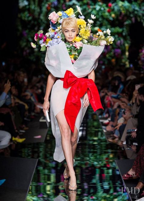 Photo feat. Gigi Hadid - Moschino - Spring/Summer 2018 Ready-to-Wear - milan - Fashion Show | Brands | The FMD #lovefmd Camp Fashion, Fantasy Clothes, College Work, Floral Inspiration, Kaia Gerber, 2018 Fashion, Jeremy Scott, Gigi Hadid, Memorable Moments