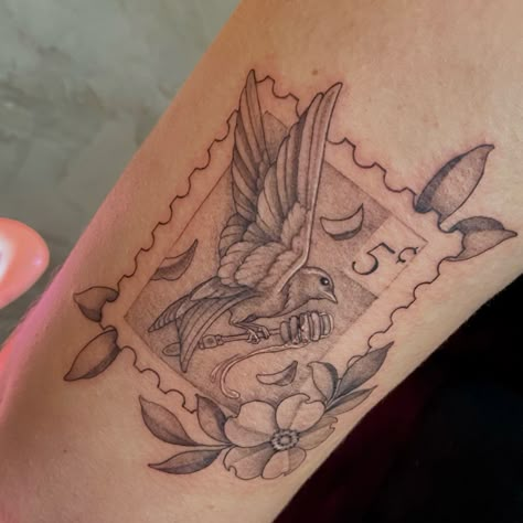 Tattoo designed with a stamp as a frame, bird, and some accenting florals Harry Styles Bluebird Tattoo, Cardinal Stamp Tattoo, Small Stamp Tattoo, Parakeet Tattoo, Postal Stamp Tattoo, Stamp Tattoo Design, Postcard Tattoo, Bluebird Tattoo, Stamp Tattoo