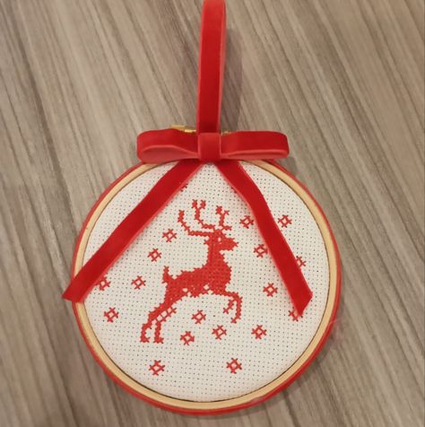 A Christmas decoration with red stag design made from cross stitch on embroideryhoop Reindeer Cross Stitch, Stag Design, Cross Stitch Fruit, Christmas Reindeer Decorations, Christmas Cards Kids, Wooden Embroidery Hoops, Cross Stitch Christmas, Stitch Gift, Stitch Christmas