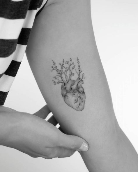 Anatomical heart with flowers tattooed on inner arm Heart Lungs Tattoo, Anatomical Heart Vase Tattoo, Realistic Heart Tattoo Flowers, Real Heart Tattoo With Flowers, Tattoo Heart With Flowers, Anatomical Heart With Flowers Tattoo, Brain With Flowers Tattoo, Heart And Flowers Tattoo, Medicine Tattoo Ideas