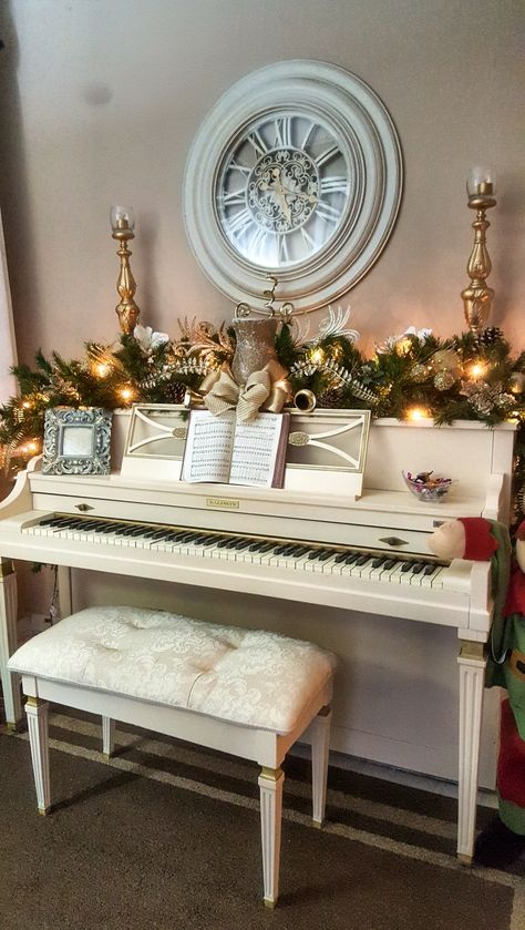 Ivory Piano Christmas Decor Christmas Decorations On Piano, Piano Decor Christmas, Top Of Piano Christmas Decor, Piano Christmas Decor Ideas, Christmas Piano Decorating Ideas, Decorating A Piano For Christmas, White Piano Decor, Piano Decorated For Christmas, Christmas Decor For Piano Top