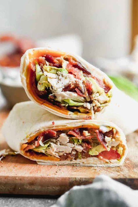 Turkey Club Wraps filled with turkey (or rotisserie chicken), bacon, lettuce, tomato, cheese and avocado. This 15-minute meal makes a great lunch or quick dinner and is nutrient packed to keep you full. Farmer Meals, Turkey Club Wrap, Teriyaki Bowls, Club Wrap, Slow Cooker Shredded Beef, Turkey Wrap, Chicken Bacon Ranch Wrap, Turkey Club, Tomato Cheese