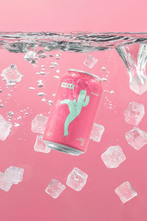 A pink canned cocktail illustrated with a green cactus dropped into iced water over a backdrop of light pink. Colourful Images Photography, Pina Colada Photography, Underwater Product Photography, Gummy Product Photography, Beverage Product Photography, Product Photography Water, Water Product Photography, Summer Product Photography, Colorful Product Photography