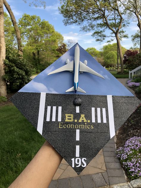 An airplane runway ready to take off into a new adventure! The plane was velcroed on so it can be positioned as a landing and take off. #flightschool #airplane #pilot #graduation #gradcap #runway #airforce #airforcegraduation #planes #flying #pilotschool #graduationcap Plane Graduation Cap, Pilot Graduation Party, Flight Attendant Graduation Cap, Aerospace Engineering Graduation Cap, Aerospace Graduation Cap, Airplane Graduation Cap, Air Force Graduation Cap, Pilot Graduation Pictures, Aviation Graduation Party