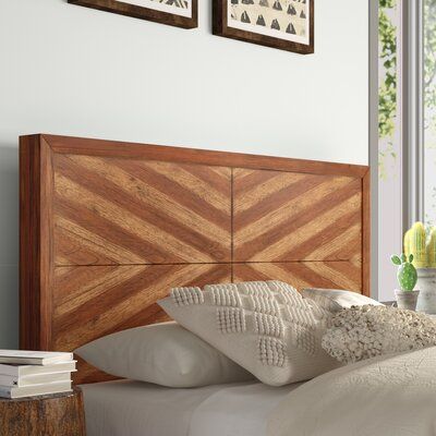 This clean-lined panel headboard is a stylish way to top off your bed in the main bedroom or guest room. Its square-shaped design is crafted from a blend of solid wood, and it boasts a distressed toffee-colored finish for a rustic look. The geometric panels in a two-toned hue add a decorative touch to your space. Its pre-drilled holes make installation a breeze thanks to the included mounting hardware. Plus, it's compatible with adjustable beds. Size: Queen | Mistana™ Tarin Solid Wood Panel Head Bohemian Style Bedding, Wood Panel Headboard, Geometric Headboard, Boho Headboard, Headboard Wood, Affordable Boho, Solid Wood Dresser, Boho Chic Bedroom, House Bedroom