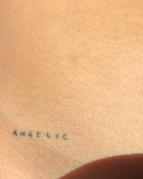 Dainty Words Tattoo, Loved By An Angel Tattoo Words, Angel Tattoo On Hip, Angel Hip Tattoo, Fine Line Lettering Tattoo, Fine Line Tattoo Angel, Angel Tattoo Writing, Dainty Letter Tattoo, 4 Letter Words Tattoo